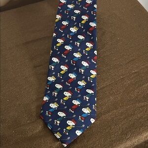 Snoopy playing golf tie lots of snoopy